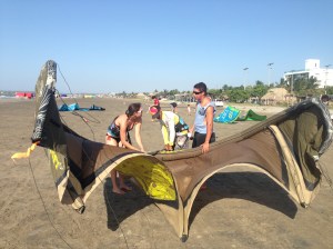 Jesus and Miguel show me how to get the kite ready.